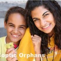 Volunteer and student smiling