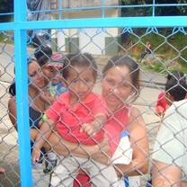 Volunteers with children at a playground in Costa Rica
