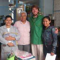 A volunteer with locals in Quito