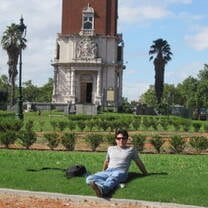 Volunteer sitting on the grass