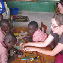 Volunteer teach at a school in Kenya