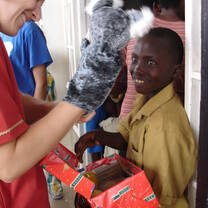 Volunteer with local community members in Rwanda