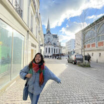 A student smiling in the streets of Nice.