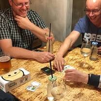 Friends playing boards and brews