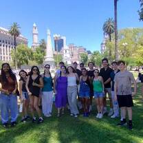 Group of teenagers posing in front of historic building in Buenos Aires