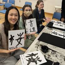 Students in Kyoto practicing writing kanji