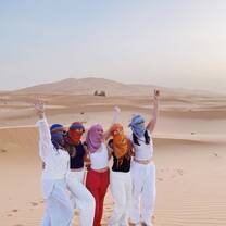 Girls enjoying the sand dunes