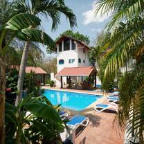 The EF campus in Tamarindo, Costa Rica offers students a tropical residence with a pool, palm trees, and outdoor study spaces—perfect for experiencing pura vida during a gap semester abroad.