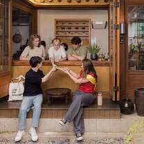 EF Gap Year students sharing tea in a traditional Korean teahouse in Seoul, South Korea, experiencing local culture and building friendships during their program abroad.