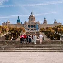 EF Gap Year students walking down the steps of the National Art Museum of Catalonia (MNAC) in Barcelona, Spain, enjoying a sunny day of art, history, and exploration.