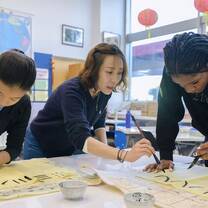 JADE Ambassadors Learning Calligraphy
