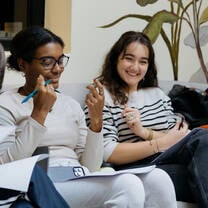 Students sitting and laughing. 
