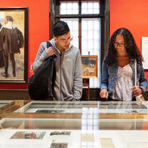 Students looking at photographs. 