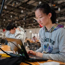 Student at laptop. 