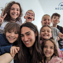 A Meddeas Language Assistant and her students