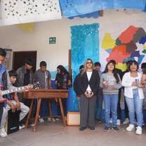 Students singing and playing instruments