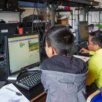 Students learning computer skills