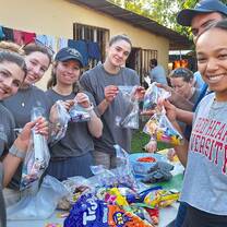 Students prepare meal to serve to migrant populations at border 