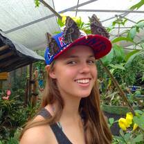 Girl with butterflies on her hat in Costa Rica