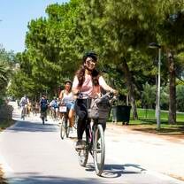 Girl riding bike in Turio Gardens in Valencia