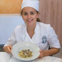 Culinary student showing off their finished dish