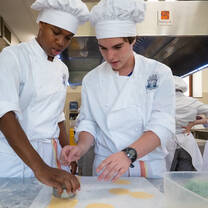 Culinary students making pasta