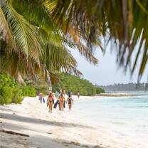 Students walking on beach Coco's Keeling