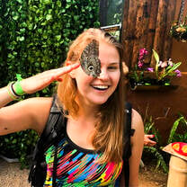Student with butterfly in Ecuador