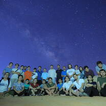 Group photo in the desert at night