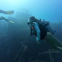 Students earning open water PADI certification on Willy T wreck dive near Peter Island