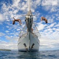 Students doing boat jumps in Fiji