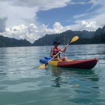 A photo of a young teacher rowing a Kayak in Khao Sok National Park