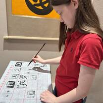 Student writing Chinese