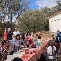 group of students sitting down for a meal outside