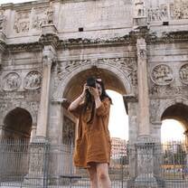Student taking a photo of emblematic European architecture during a study abroad trip.