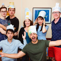 Students in classroom wearing hats