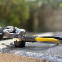 a close up shot of a scuba regulator on the edge of a cleaning tank