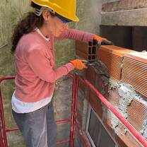 Volunteer working on the construction site of the cultural center.