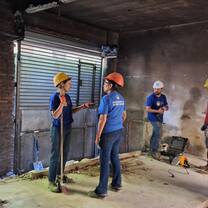 Volunteers working on the construction site of the cultural center.