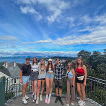 A group of friends with a view of the city in the background