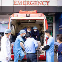emergency team helping the patient in ambulance 