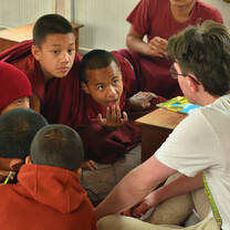 Tim from Germany teaching monks in monastary 