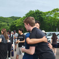 Participants saying goodbye to their host families