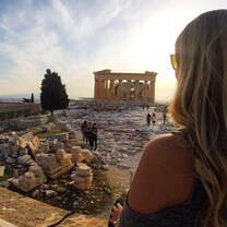 Girl looking out over Athenian ruins