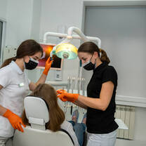 Dental interns helping a patient in Poland