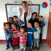Nepal Teaching Volunteer with a Class of Children