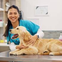 Female Poland Veterinary Intern with a Dog