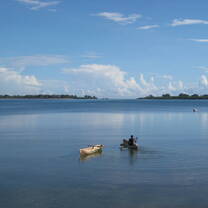 Local fisherman paddling a traditional canoe in southern Tanzania