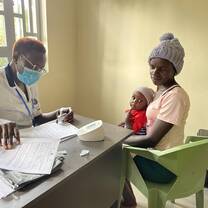 Medical care - woman with baby