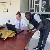 Volunteer instructing receptionist